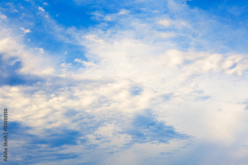 Blue sky with spindrift clouds, may be used as background.