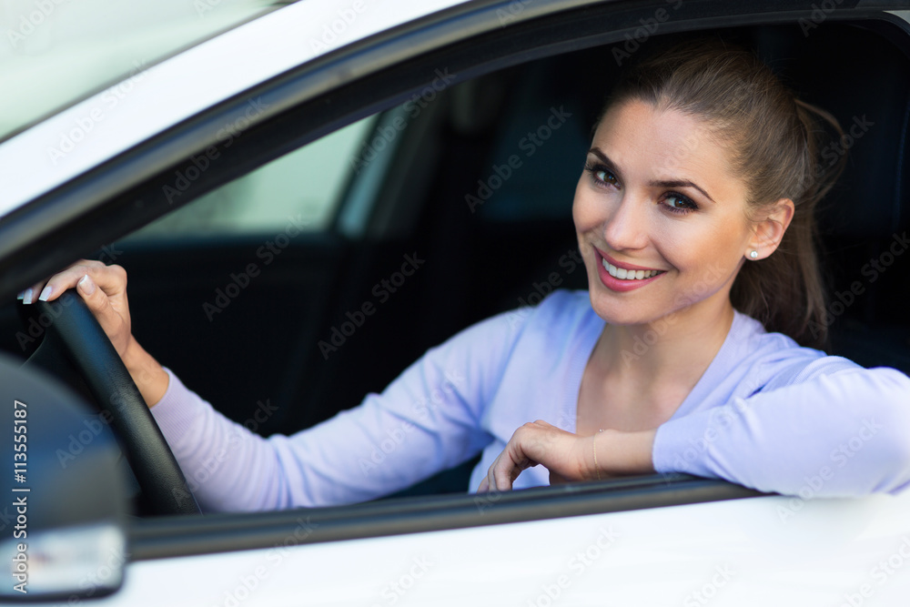 Young woman sitting in a car 
