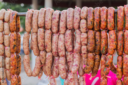 Traditional food. Smoked sausages meat hanging