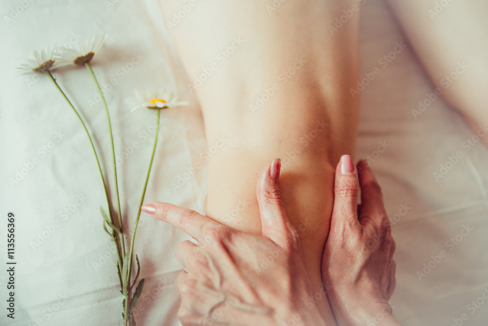 Naklejka premium Woman having sports foot massage.