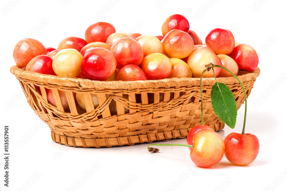 yellow cherries in a wicker basket isolated on white background yellow cherries in a wicker basket isolated on white background