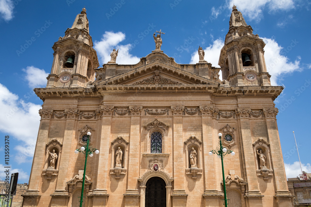 Naxxar, Malta - 2016, June 11th : The facade of the historic Our Lady of Victories parish church of Naxxar, a town in the center of Malta