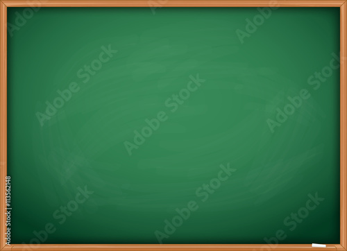 Green chalkboard blackboard with chalk traces and wooden frame.
