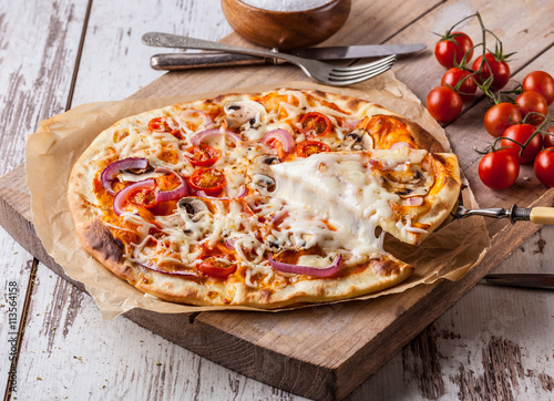 Homemade pizza with melted cheese