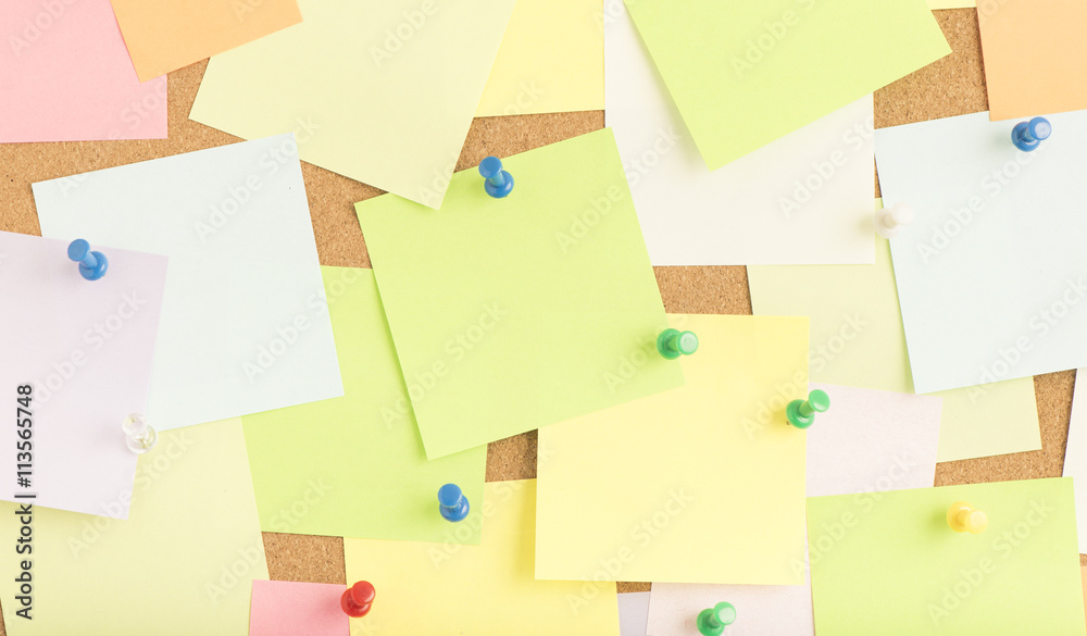 Empty blank sticky notes on notice board in office. Background or backdrop for business information. Concept image of communication or reminder with copy space. Empty blank sticky notes on notice board in office. Background or backdrop for business information. Concept image of communication or reminder with copy space.
