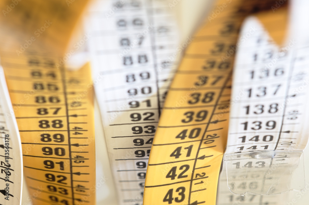 Tape-measure with reapeated numbers. Abstract background Tape-measure with reapeated numbers. Abstract background