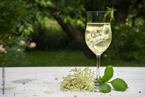 Photography soft drink from elderflower syrup, juice, sparkling wine and soda in the garden