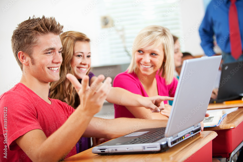 High School: Teen Students Using Laptops in Class High School: Teen Students Using Laptops in Class
