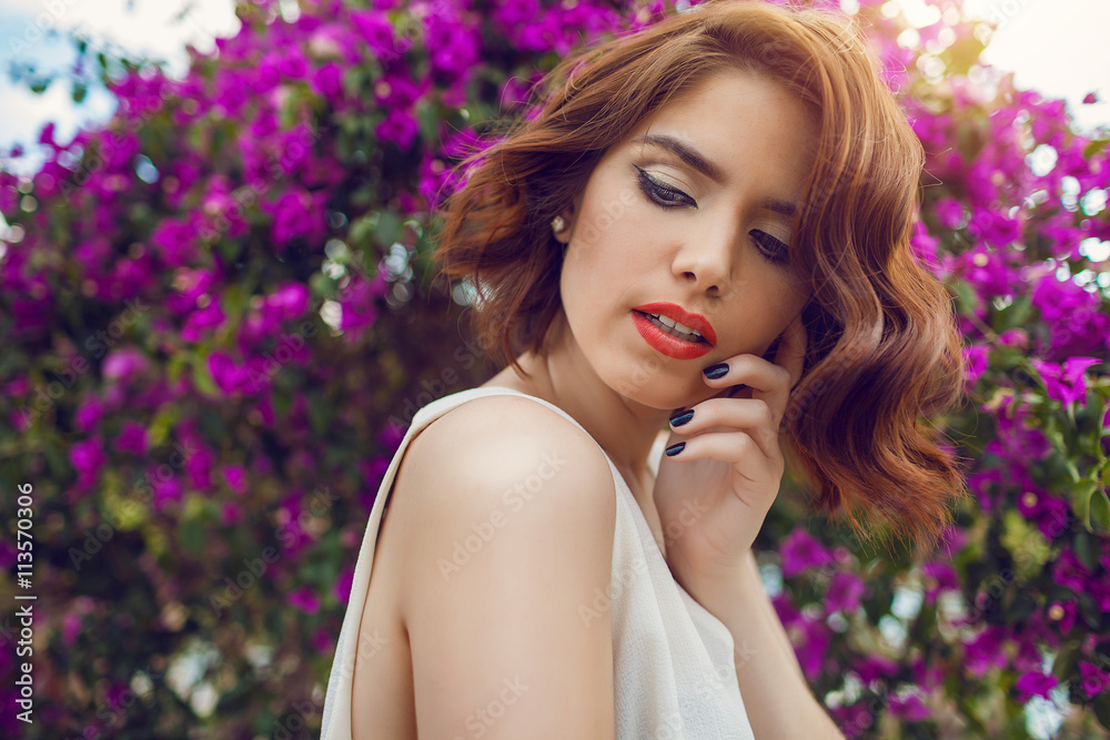 Obraz premium Fashion outdoor photo of beautiful young woman with red hair in elegant clothes.