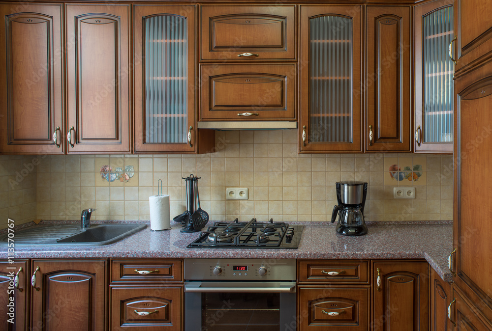 ?itchen with integrated appliances. Wooden design.