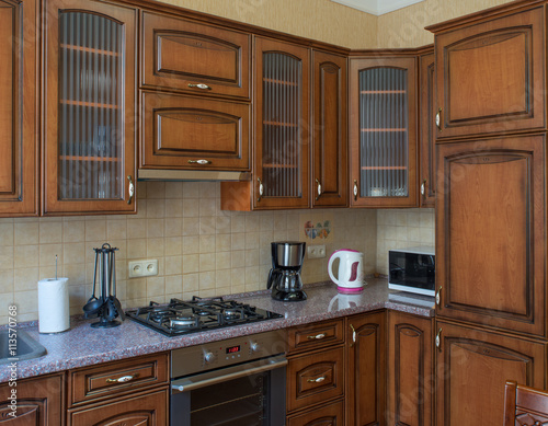 ?itchen with integrated appliances. Wooden design.