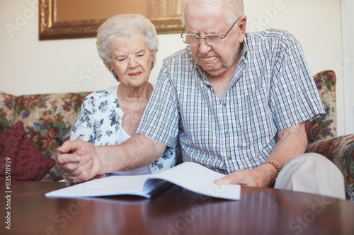 Mature couple going through some retirement paperwork