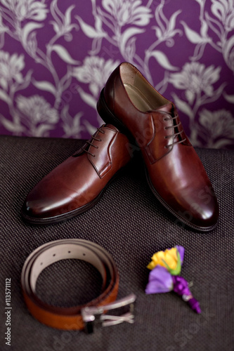 Beautiful wedding details from ceremony and reception. man s shoes  belt. brown.