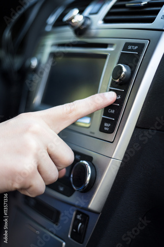 male hand pressing button in car © Di Studio