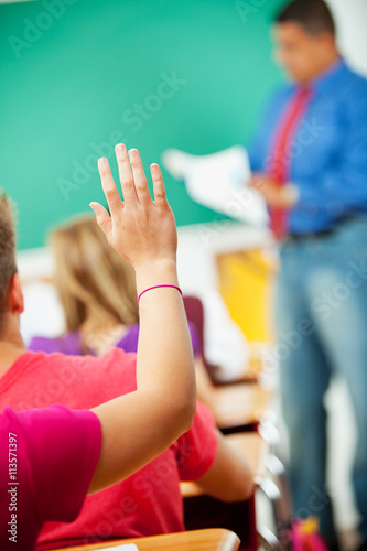 High School: Girl Raises Hand in Class © seanlockephotography