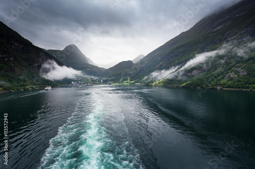 View of ship tracks in sea near fjord