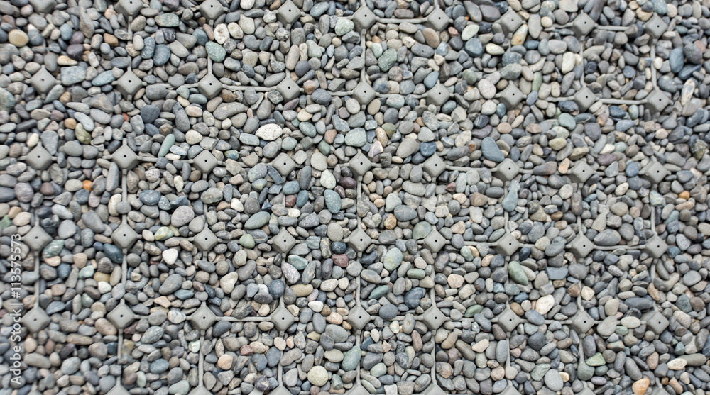 The close up Rock texture background with plastic net prevent slip The close up Rock texture background with plastic net prevent slip