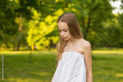 Outdoors portrait of beautiful young girl with long hair © Nadya Kolobova