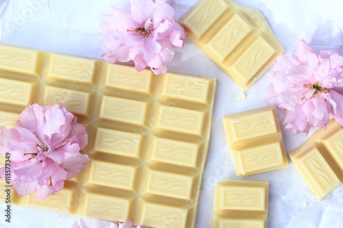 A bar of white chocolate with Japanese cherry blossom flowers