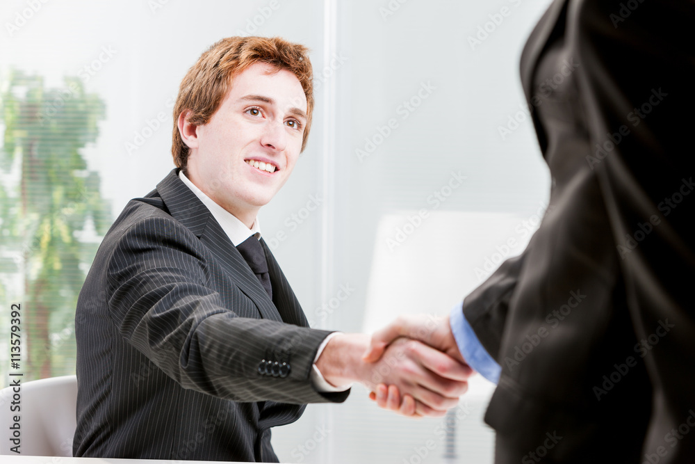 red headed businessman shaking hands red headed businessman shaking hands
