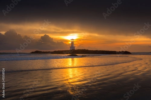 Lighthouse in sunset © Peera