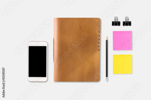 Brown Leather notebooks with pencil smartphone on white table ba photo