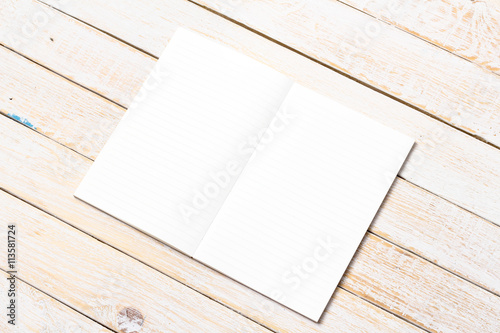 Blank open notebook with on wood table,Business template mock up