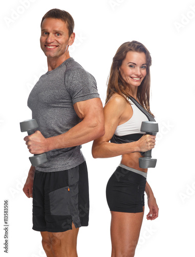Sporty couple with dumbbells.