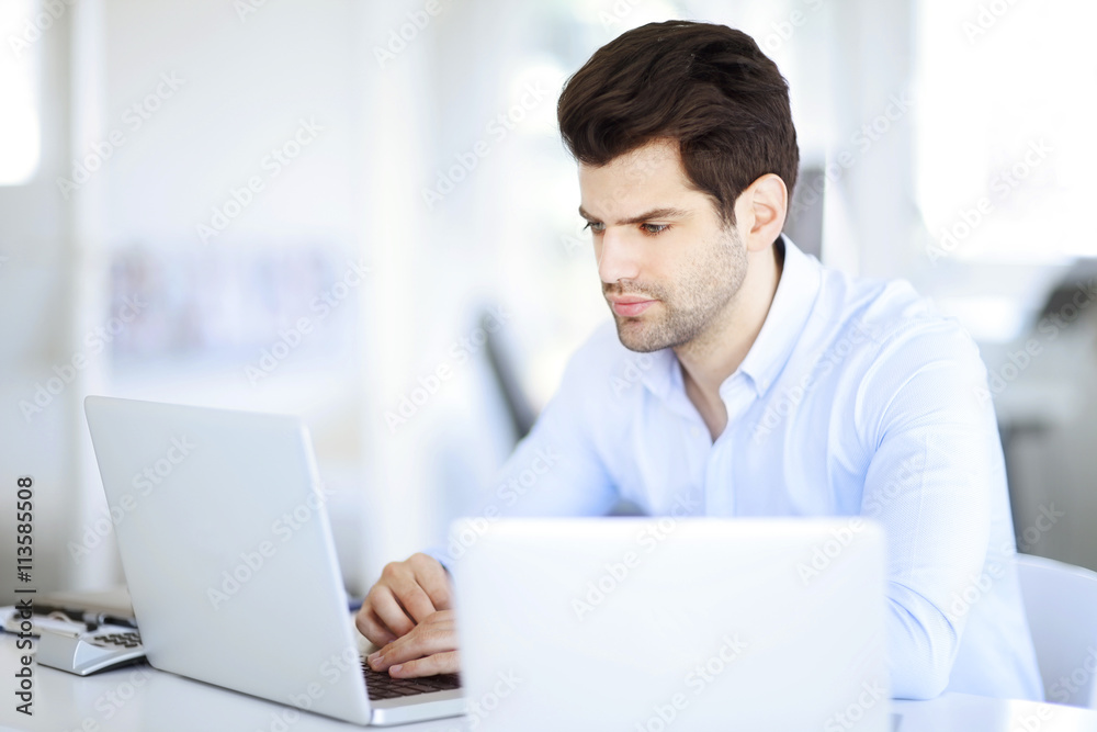 Successful professional man working at office Successful professional man working at office