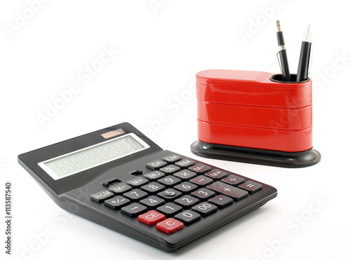 calculator and desk organizer with pen isolated on white, workspace in tidy office photo