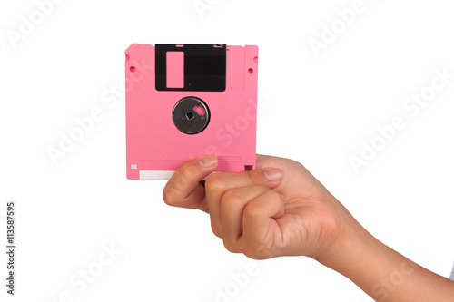 Plakat Holding floppy disc on white background. Computer floppy disk in hand.