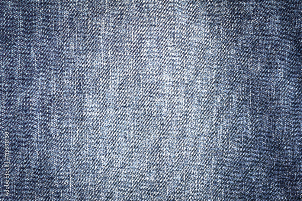 Closeup denim jeans texture. Stitched textured blue denim jeans background. Old grunge vintage denim jeans. Denim jeans fashion design. Dark edged. Closeup denim jeans texture. Stitched textured blue denim jeans background. Old grunge vintage denim jeans. Denim jeans fashion design. Dark edged.