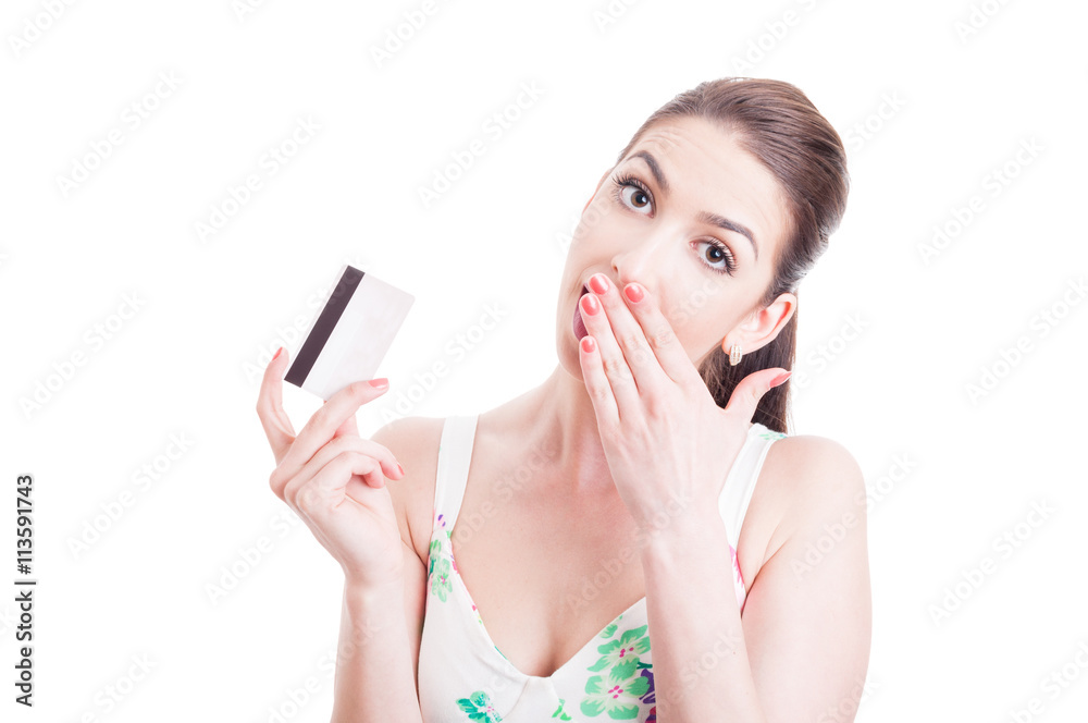 Pretty lady holding card and feeling surprised or amazed Pretty lady holding card and feeling surprised or amazed
