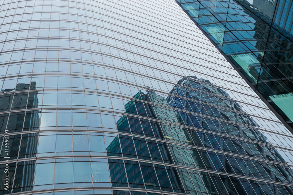 Skyscrapers with glass facade. Modern buildings in Paris business district. Concepts of economics, financial, future. Copy space for text. Dynamic composition. Skyscrapers with glass facade. Modern buildings in Paris business district. Concepts of economics, financial, future. Copy space for text. Dynamic composition.
