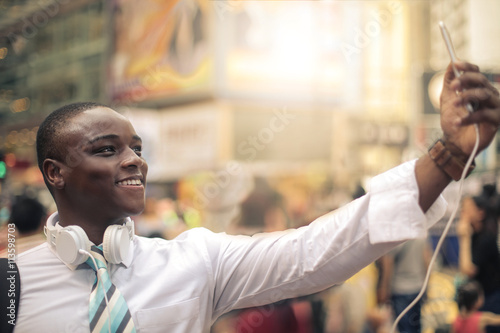 Young businessman doing a selfie