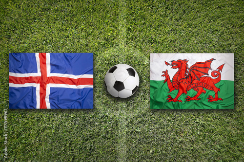 Iceland vs. Wales flags on soccer field