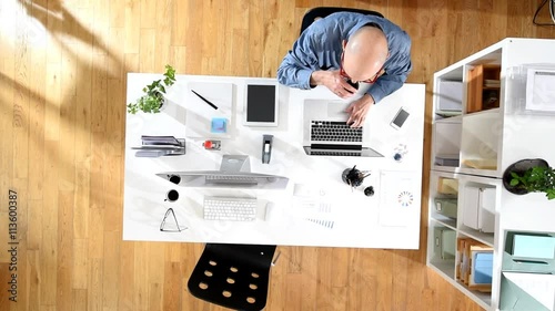 top view, senior businessman working at his desk at office