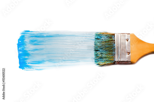 paint brush and blue dab of toothpaste. blue tooth paste. texture. sample and brush isolated on white background