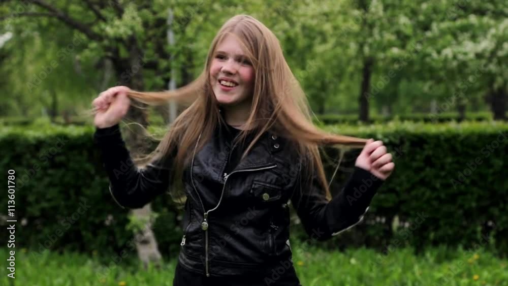Beautiful teenage girl long blond hair moving dancing crazy emotions in park HD Beautiful teenage girl long blond hair moving dancing crazy emotions in park HD