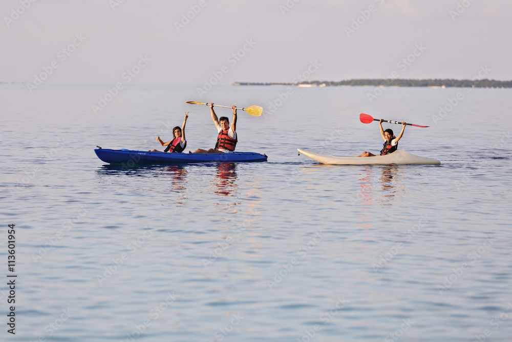 happy family with a sea kayak