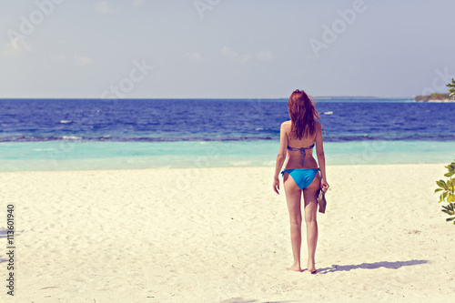 a beautiful woman on a tropical beach