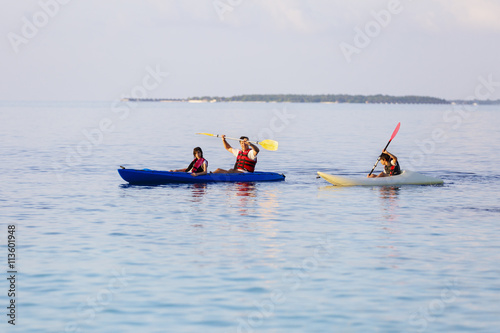 happy family with a sea kayak
