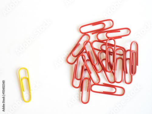 Paper clips arrange to symbolize on white background to be diffe