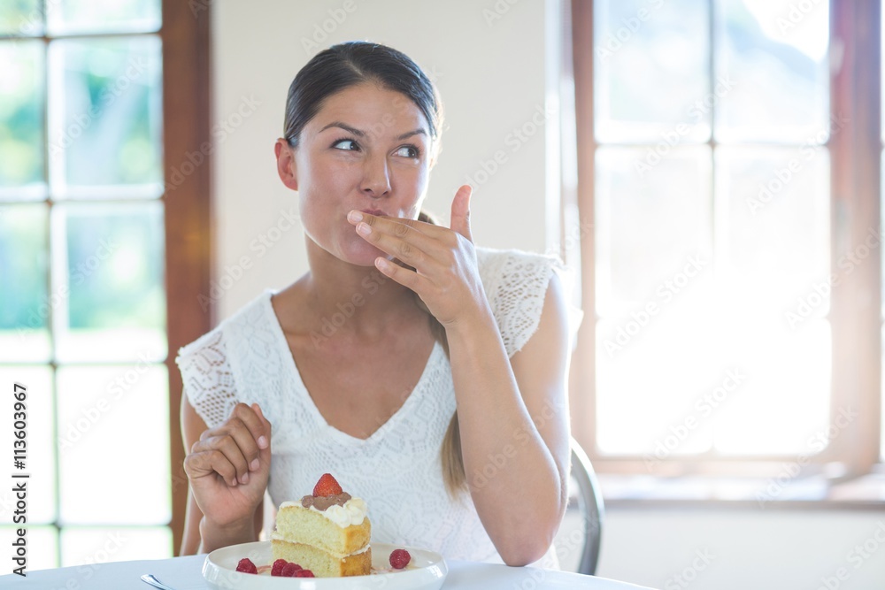 Woman having a pastry in restaurant Woman having a pastry in restaurant