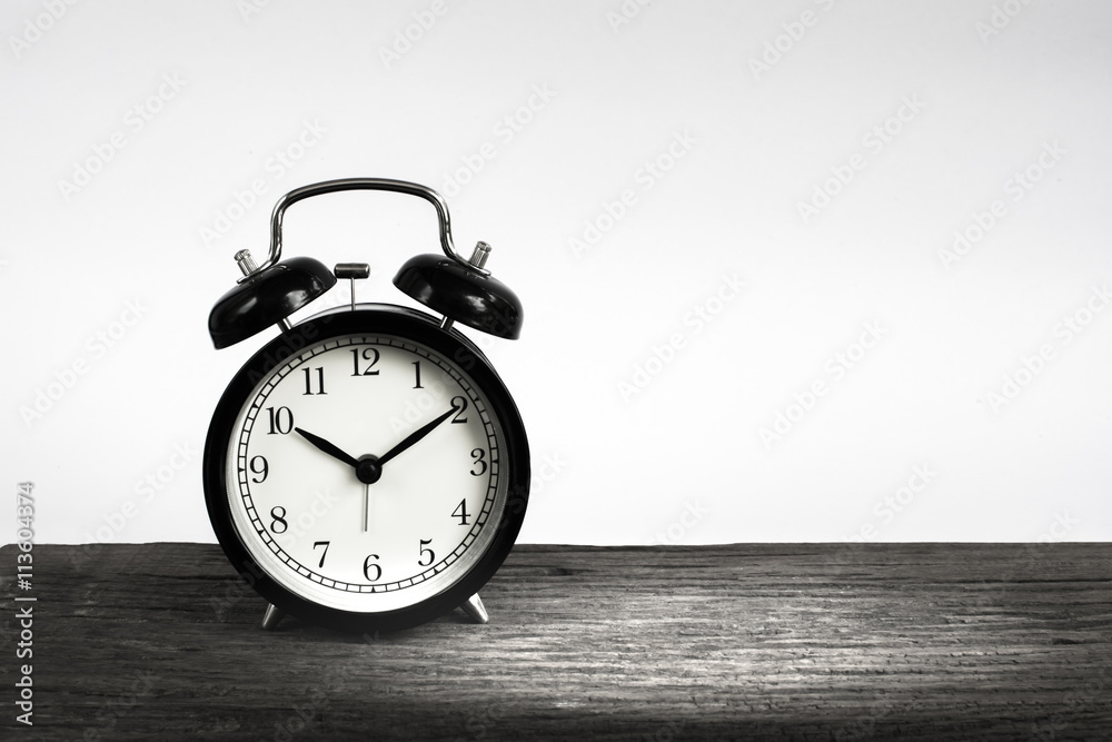 Alarm clock on wood isolated on white background. Alarm clock on wood isolated on white background.