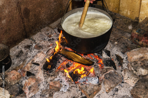 Cooking fires in a black iron pot