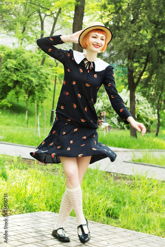 Photography Happy, smiling carefree young woman in a dress retro style, dancing swing, solo jazz and lindy hop