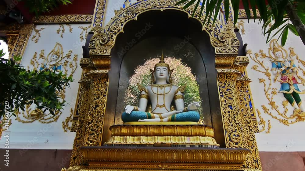 Buddha in Wat Chiang Man temple in Chiang Mai, Thailand. Camera dolly. Zoom out.