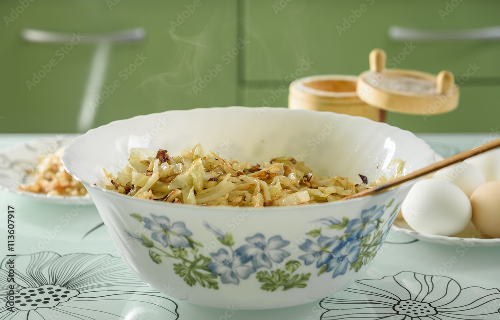 white bowl with roasted cabbage for pies white bowl with roasted cabbage for pies