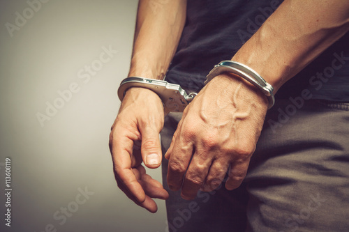 male hands in handcuffs